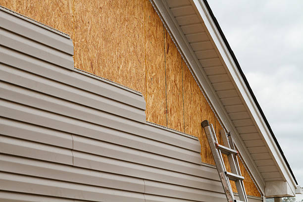 Professional Storm Damage Siding Repair technician working in Turbotville, PA
